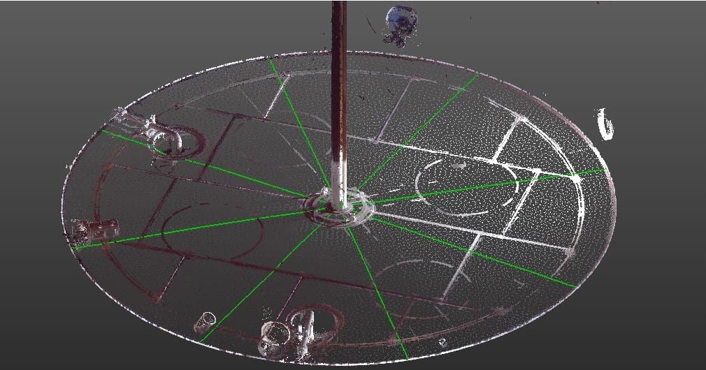 Improving Tank Maintenance 7 Scanner data of tank interior showing floor and interior piping. White dots indicate individual measurements on the floor.