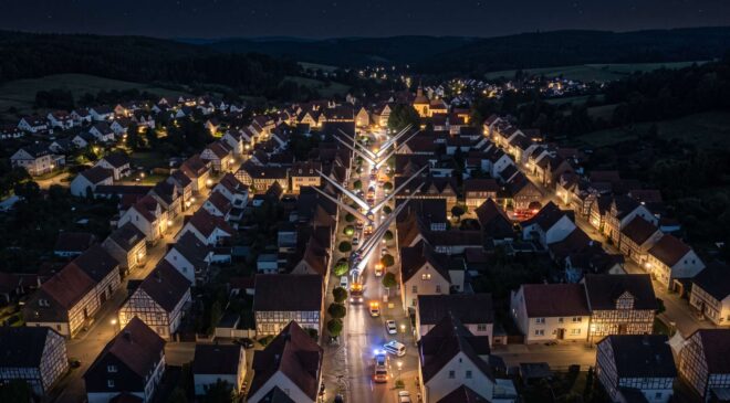 In Germany, they had to transport 15 wind turbine blades, each 260 feet long, at night, so they tilted them 60 degrees to weave like streamers over rooftops and treetops as they moved at 7 mph 11 wind turbine blades being transported Germany