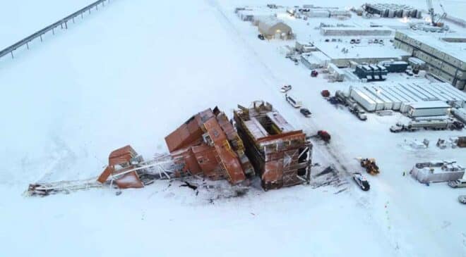 Drilling rig module toppled onto snow covered Arctic tundra