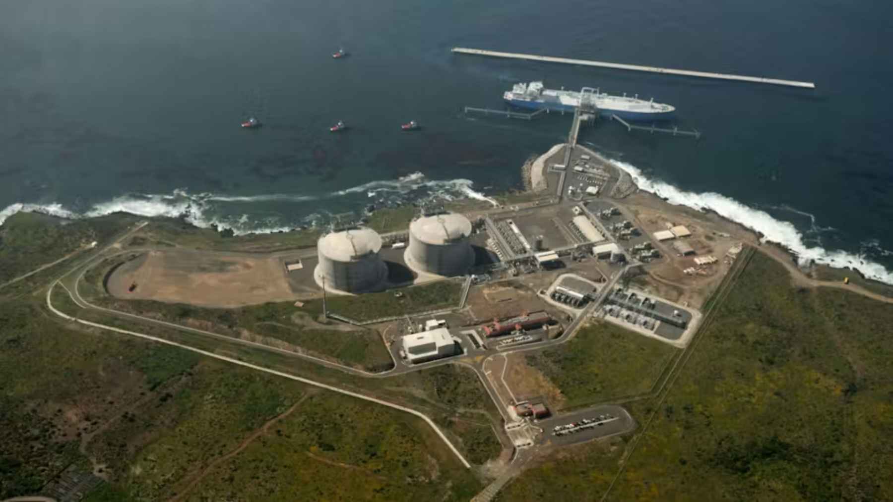 LNG tanker at Ensenada Pacific coast LNG terminal at dusk
