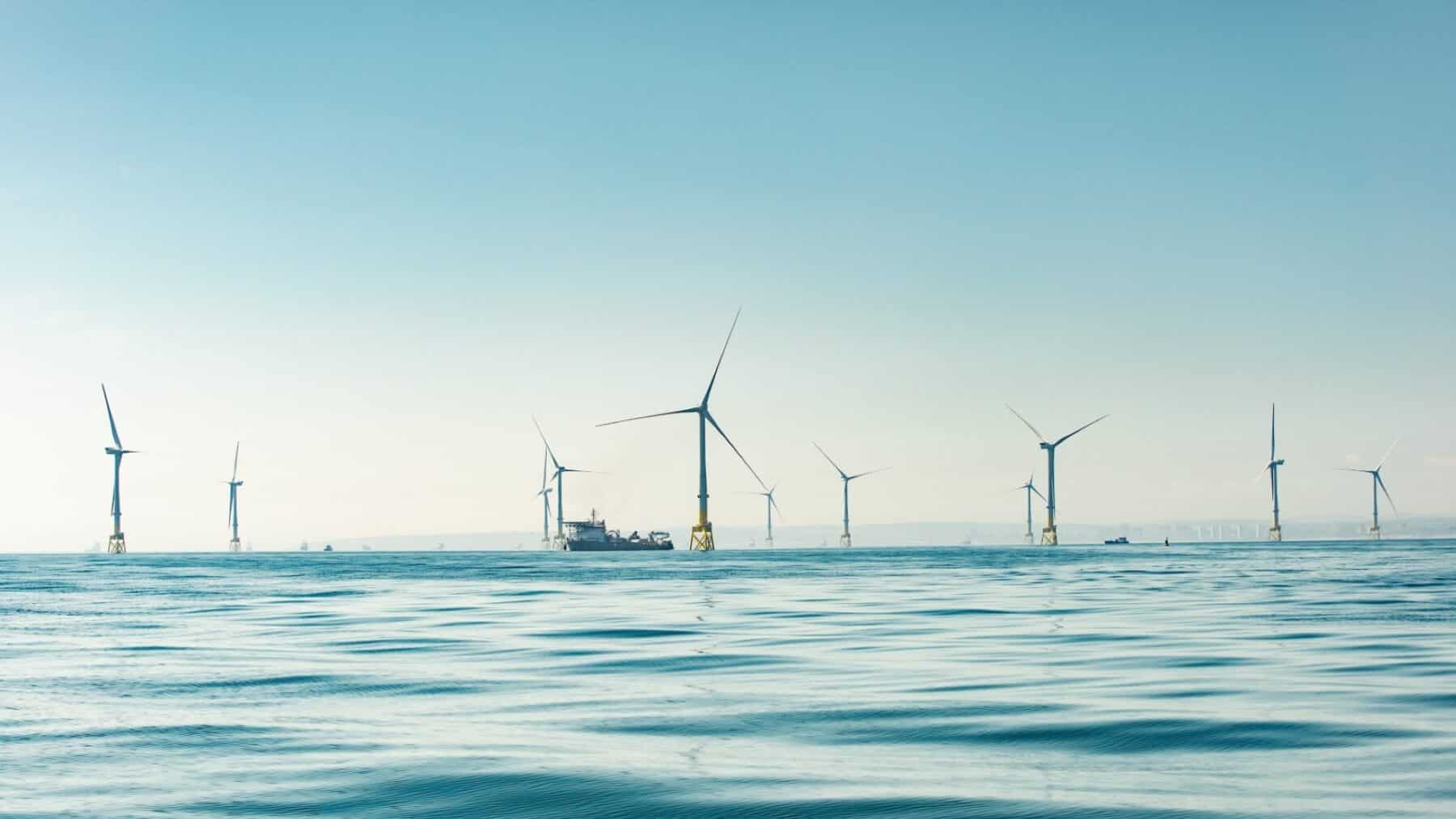 Eleven turbines off Aberdeen Bay near a golf course coastline, eleven turbines keep