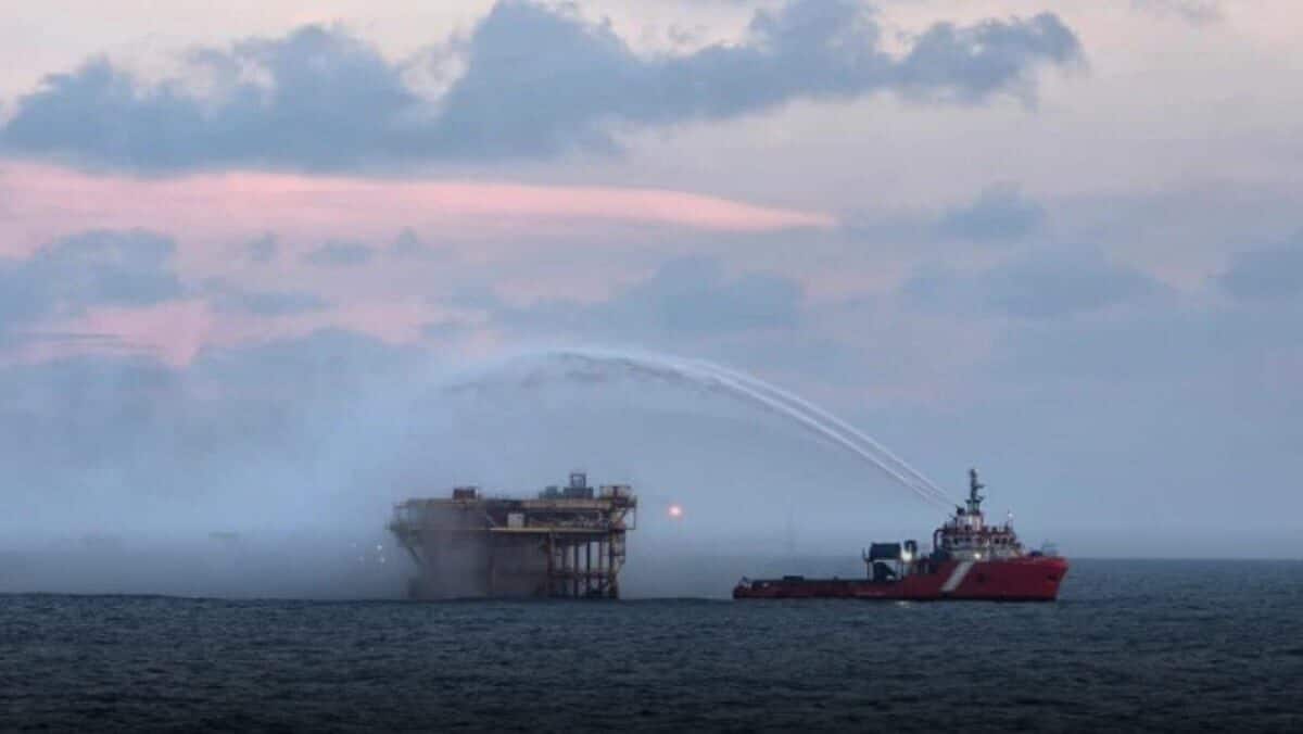 Search vessel scanning North Sea waters after jackup rig sank, jackup rig standing