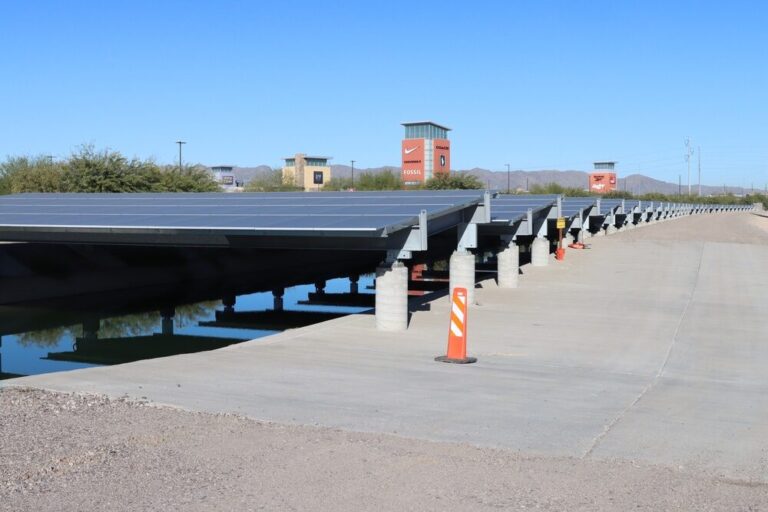 Canal top solar panels mounted on steel trusses above an Arizona irrigation canal, never gets touched
