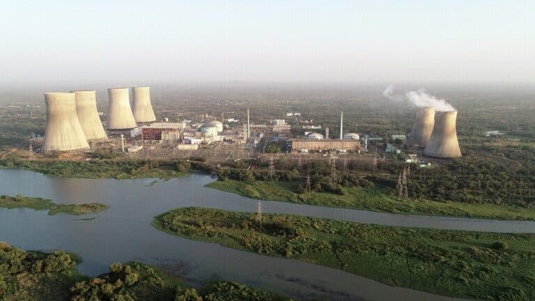 Off Zhejiang's coast a carmaker bought a two percent stake in a nuclear plant rated near 1,100 megawatts per unit, and San'ao unit one became China's first reactor built with private money 20 San'ao reactor dome beside Zhejiang bay at blue hour, off zhejiang s