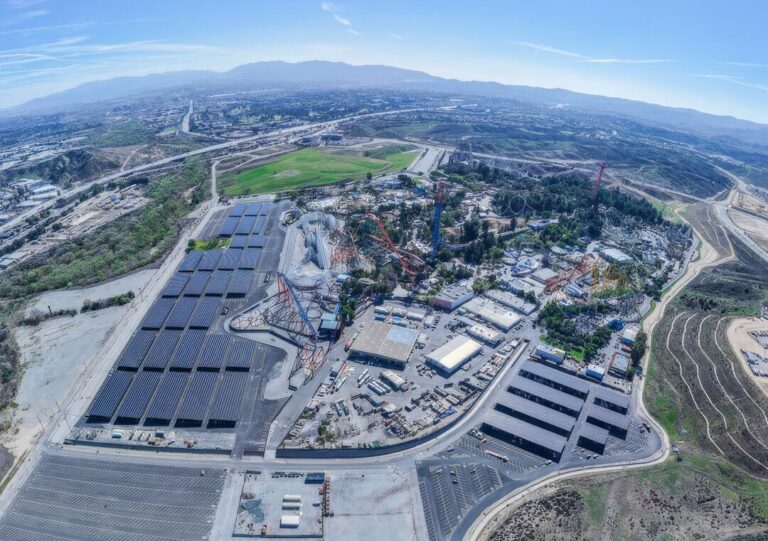 Beneath 36 steel canopies over a theme park’s asphalt, 22,908 panels went live in October, and the lot produces more power than the rides upstairs consume all year