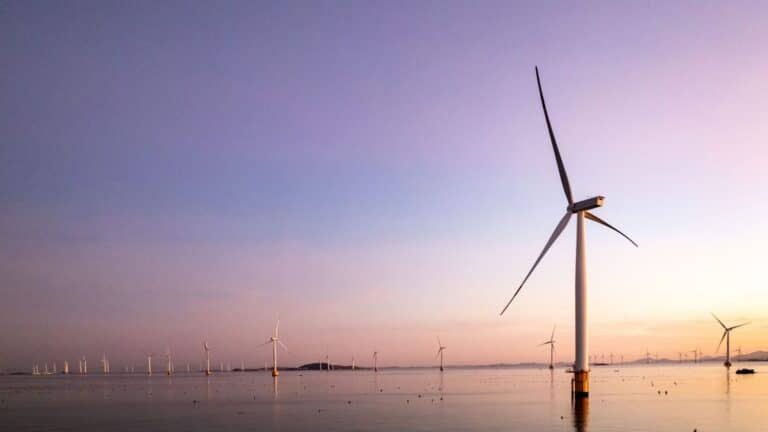 Rows of 18 megawatt offshore wind turbines standing in open sea, turbines off guangdong