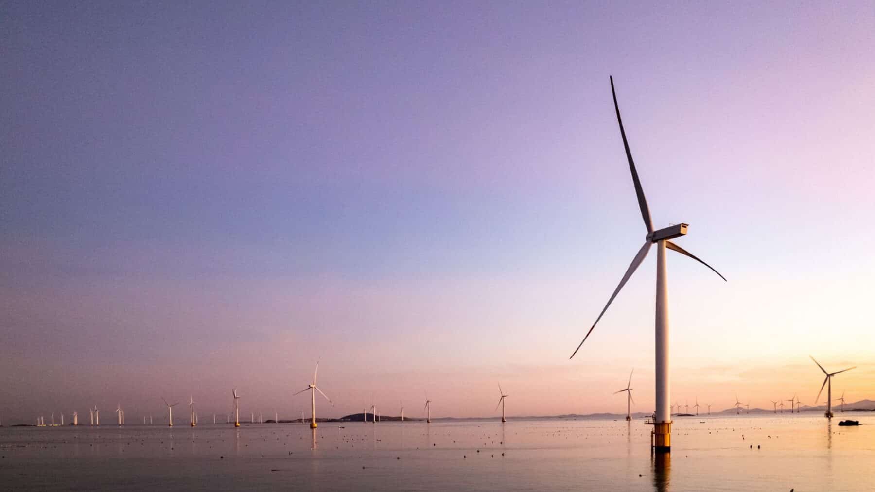 Rows of 18 megawatt offshore wind turbines standing in open sea, turbines off guangdong