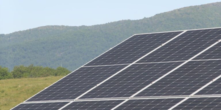 At Virginia’s old Ivy Landfill, 7,000 solar panels sit on buried trash anchored only by loose rock, and engineers used gravity instead of posts to keep every anchor off the waste below